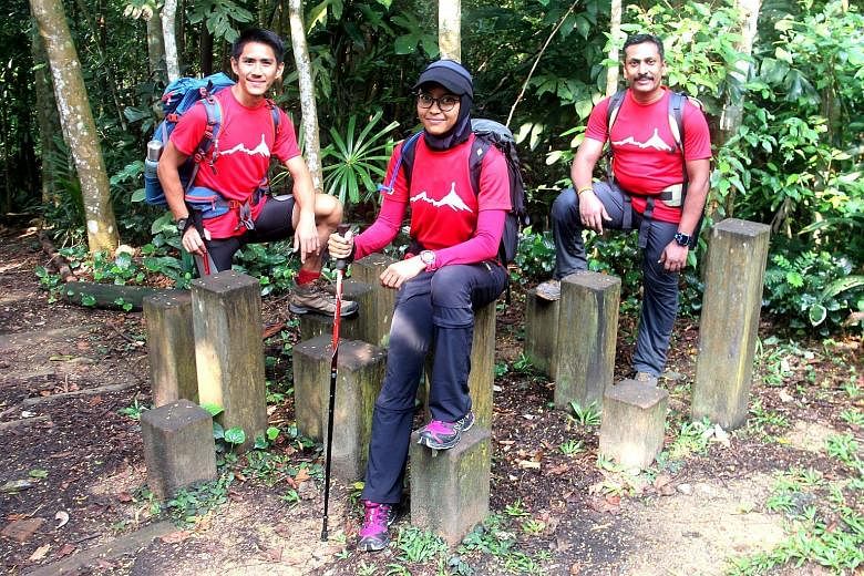 Mr Jeremy Tong, Ms Yusrina Ya'akob and Dr Arjunan Saravana Pillai at one of their training sessions at Bukit Timah Nature Reserve on Sunday. The three, who are gunning to be the first Singaporean team since 2009 to reach the top of the world's talles