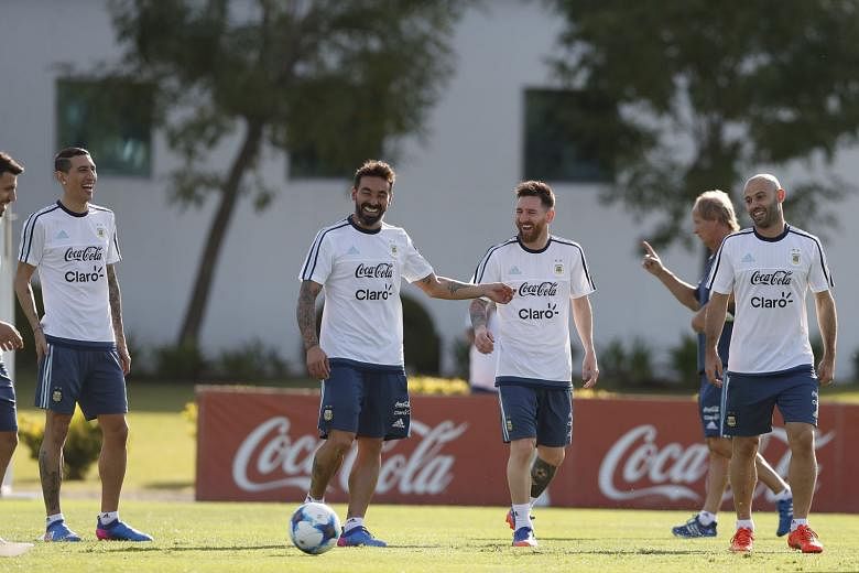 (From left) Ezequiel Lavezzi, Lionel Messi and Javier Mascherano looking relaxed during training in Buenos Aires. Argentina will face Chile today, sitting outside the automatic World Cup qualifying places. 
