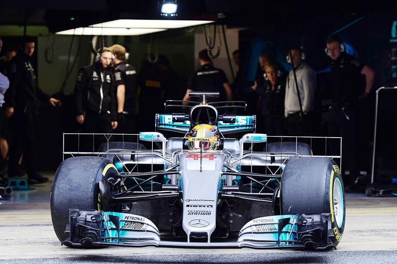 Three-time world champion Lewis Hamilton leaving the garage during testing near Barcelona. He and new team-mate Valtteri Bottas are said to be getting along well. 