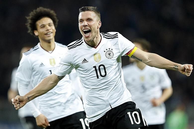 Lukas Podolski celebrating his 49th and final goal for Die Mannschaft. Podolski ends a glittering career for Germany, having won the 2014 World Cup.