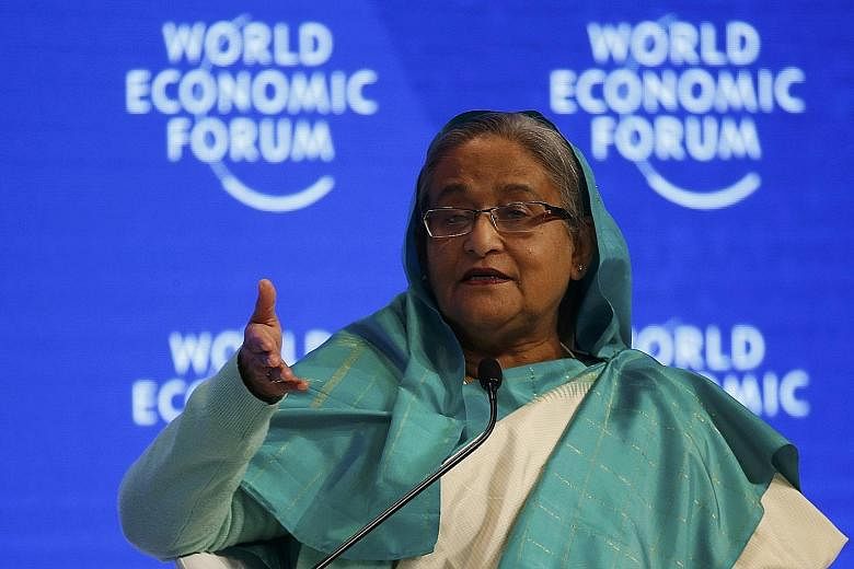 Bangladesh Prime Minister Sheikh Hasina has forged close ties with both India and China. The writer says Bangladesh must not take sides in any India-China rivalry.