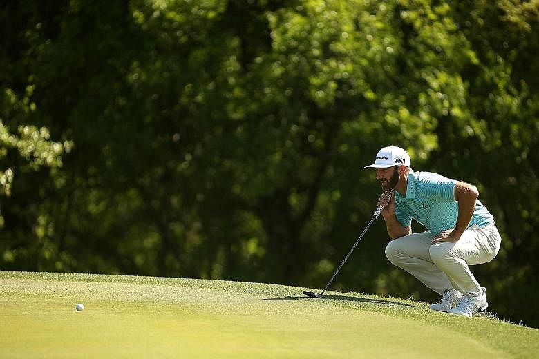 Dustin Johnson lining up a putt during the WGC-Dell Matchplay at the Austin Country Club in Texas on Thursday. The US golfer is aiming to become the first man since 2014 to win three successive events on Tour.