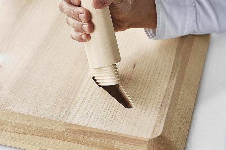 The Lisabo side table uses the wedge dowel concept (above) - threads are carved into the top part of the table leg, which is then slotted into the pre-cut hole in the underside of the table and tightened.