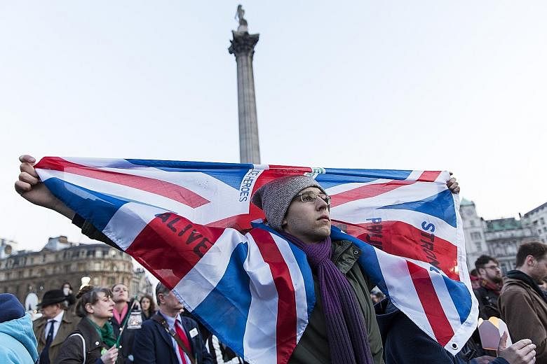 People at a vigil in Trafalgar Square on Thursday for victims of the terror attack in London. The city's Mayor Khan led the tributes in the heavily policed square, vowing that "Londoners will never be cowed by terrorism".