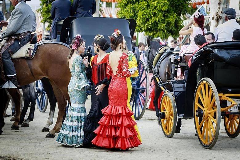 Top: Women in traditional flamenco dress at the Feria de Abril, or April Fair, in Seville, Spain. Above: Bask in Native American music and culture at the New Orleans Jazz & Heritage Festival.