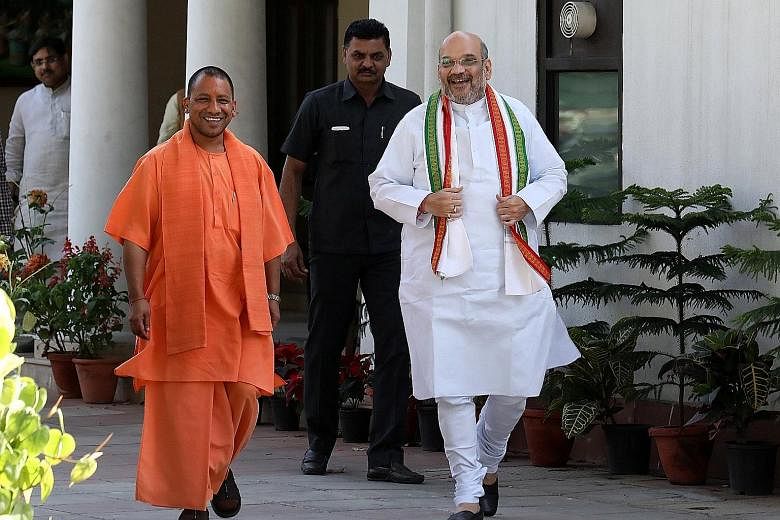 Mr Adityanath (far left), the new chief minister of Uttar Pradesh, with Bharatiya Janata Party president Amit Shah (in white) in New Delhi last week. Mr Adityanath's recent policy has been criticised as moral policing.
