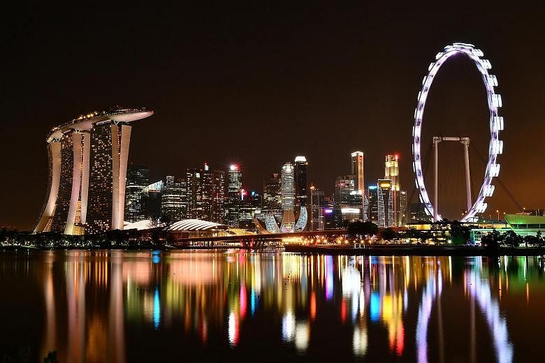 And then there was darkness - for a good cause. For an hour last night, the necklace of lights in downtown Singapore went dim, as iconic landmarks such as the Singapore Flyer switched off their non-essential lights to mark Earth Hour. The global init
