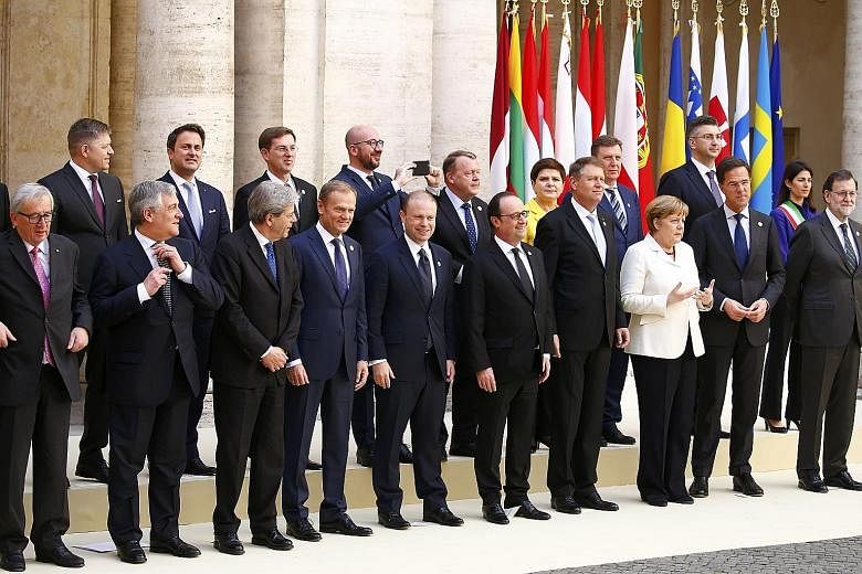EU leaders posing for a family photo in Rome yesterday. In the front row are European Commission president Jean-Claude Juncker (left), Italy's Prime Minister Paolo Gentiloni (third from left), EU President Donald Tusk (fourth from left), France's Pre