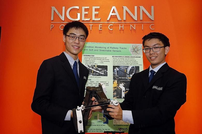 Ngee Ann Polytechnic students Tan Jian-Hui (right), 20, and Brandon Koh Wei-Han, 19, devised a sensor that monitors the condition of LRT rail systems and allows real-time detection of track faults.