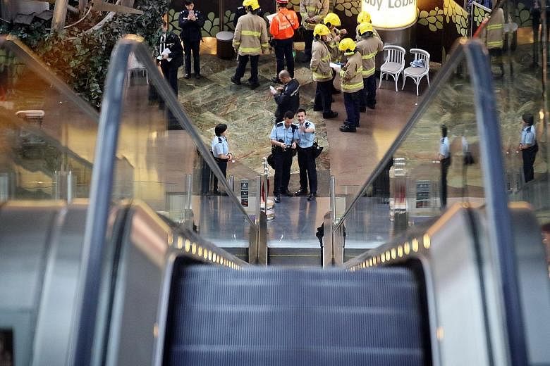 An escalator malfunctioned at Langham Place shopping mall in Mong Kok on Saturday, injuring at least 18 people after the upward-running escalator lost momentum and then began to run in reverse at high speed.