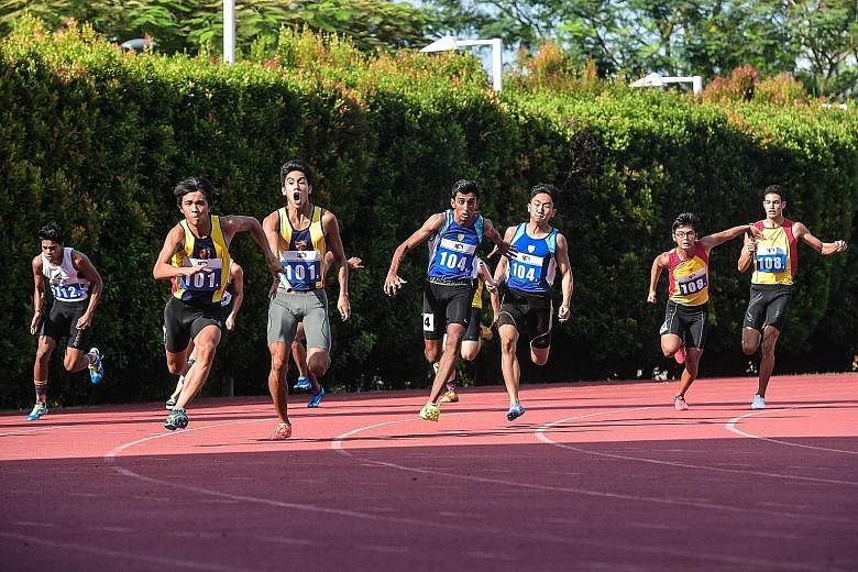 CJC's anchor runner Hassan Khan (centre) about to receive the baton from Alphonsus Teow in the 4x100m boys' A Division final of the SPH Schools Relay Championships at Bishan Stadium. ACS(I) (left) were leading marginally at the time but Hassan caught