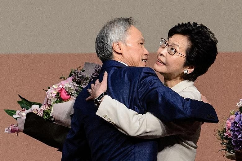 Mrs Carrie Lam with her husband of 32 years, Mr Lam Siu Por, after her win yesterday. She had planned to spend some time with him in Britain after retiring from her chief secretary job in July, but Mr Lam persuaded her to run in the chief executive e