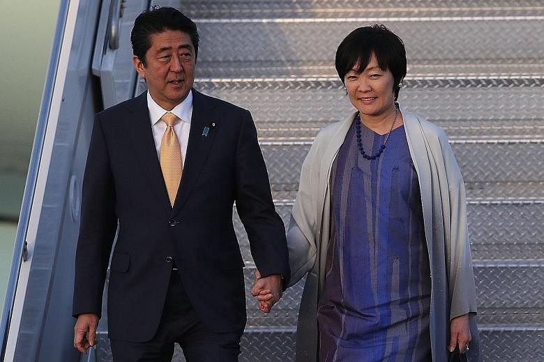 Japanese Prime Minister Shinzo Abe and his wife Akie Abe arriving at the Palm Beach International Airport to meet US President Donald Trump and his wife last month. Known for holding hands with her husband in public among other characteristics, Mrs A