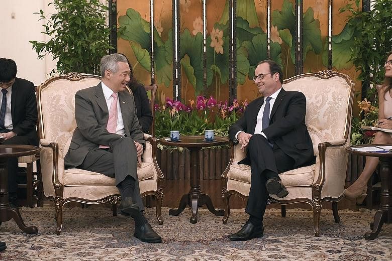 Mr Hollande calling on PM Lee at the Istana yesterday, the second and final day of his state visit here. The French President said leaders must show that the only solution for a fairer world is multilateralism, compliance with international law, resp