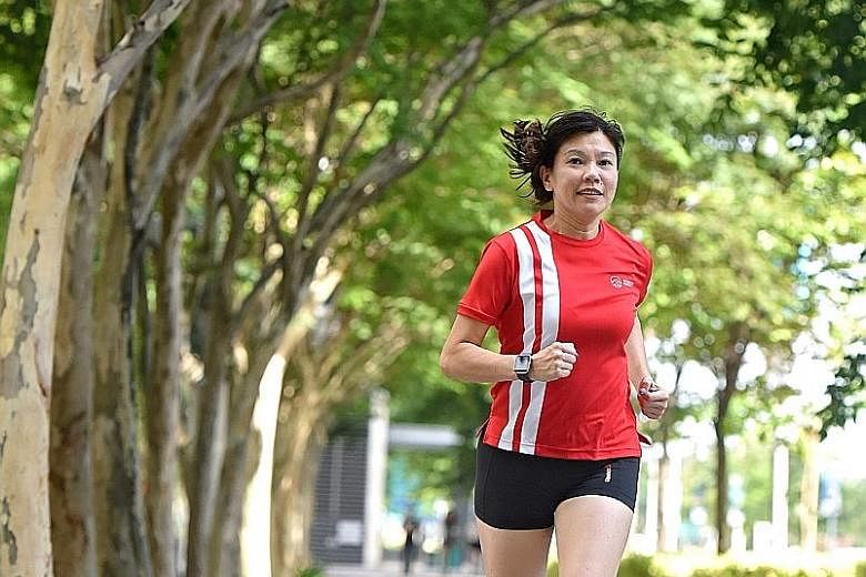 Ms Wong leads her team on 5km runs around Gardens by the Bay once a week after work. She also runs with her elder daughter on weekends and clocks about 20,000 steps every day by climbing the stairs.