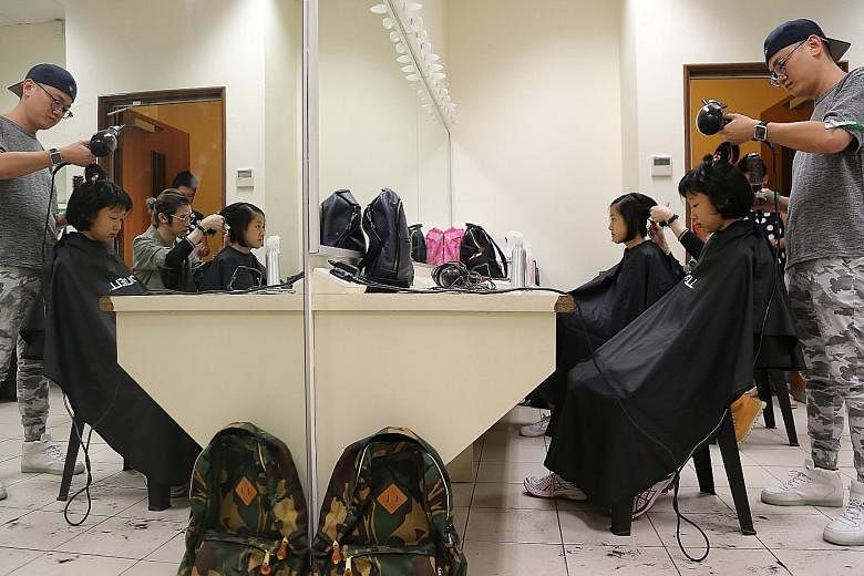Some Nanyang Girls' High School student-actors had their hair cut to portray 1930s and 1980s students in a 45-minute movie, produced as part of the Nanyang family of schools' centenary celebrations this year. The festivities also include a gala dinne