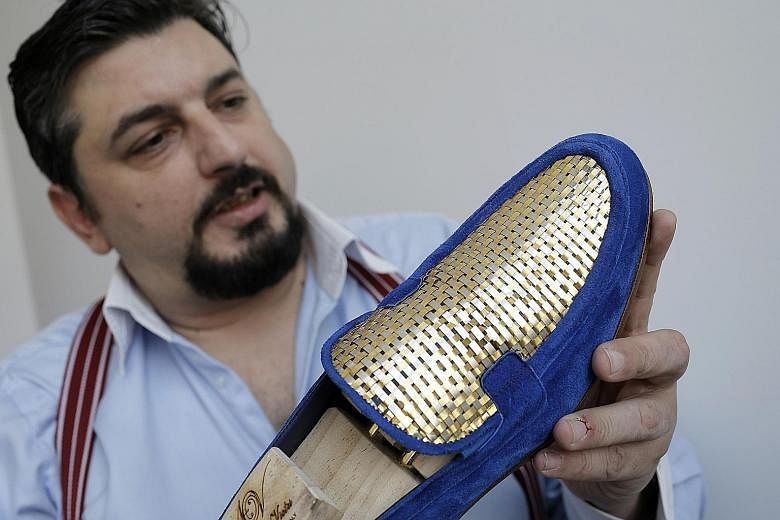 Filthy rich and already boast enough glass slippers? Shoemaker Antonio Vietri from Turin, Italy, hopes to attract shoppers from wealthy Gulf countries with his 24K gold shoes: blue or black suede moccasins with stitched gold-plated uppers. "The parti