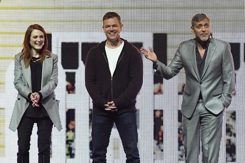 (From left) Julianne Moore, Matt Damon and George Clooney presented footage from noir thriller Suburbicon. Actor Zac Efron lent his star power to the segment on the upcoming adaptation of the popular 1990s television show, Baywatch.