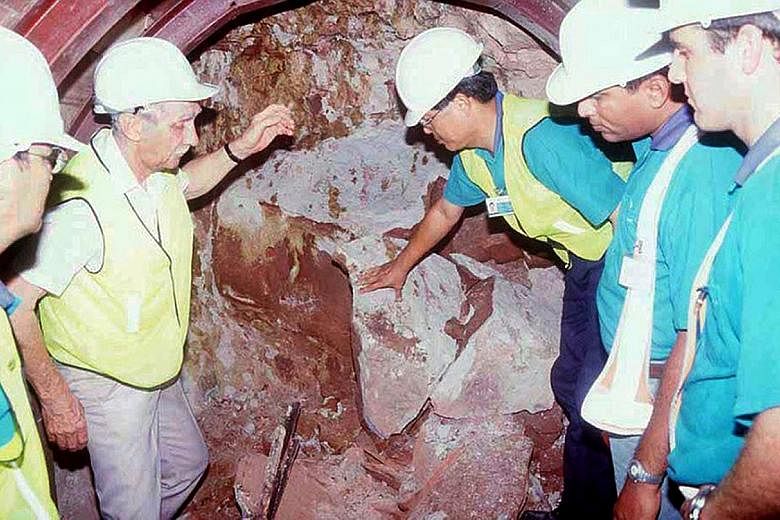 Left: Mr Terry Hulme with Mr Ow Chun Nam (at the tunnel wall), Mr Kulaindran Ariaratnam (next to Mr Ow) and other LTA engineers in the then incomplete North East Line tunnel.