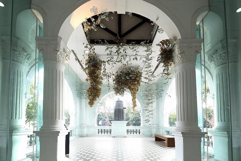 Filipino artist Ryan Villamael's paper-and-felt installation, Locus Amoenus, was suspended from the ceiling of the second floor during the Singapore Biennale. The centrepiece of the entrance foyer at the Singapore Art Museum is a bronze statue of St 