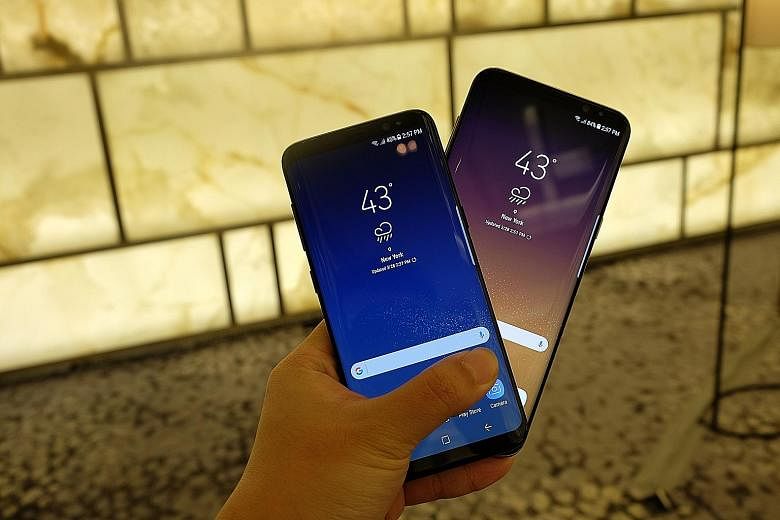 Samsung launched its latest smartphones, the 5.8-inch Galaxy S8 (far left) and a bigger 6.2-inch Galaxy S8+, in New York yesterday. Analysts do not expect consumers to rush out and get the phones as they will be more wary after the Note7 debacle.