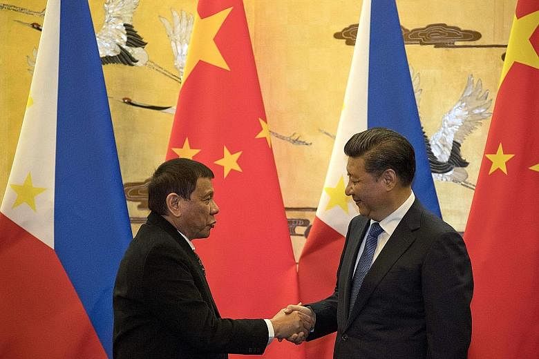 Mr Duterte meeting Mr Xi in Beijing last October. The Philippine leader has repeatedly said he does not want to go to war with Beijing over the South China Sea row, and has pivoted Manila's foreign policy away from the US towards China.