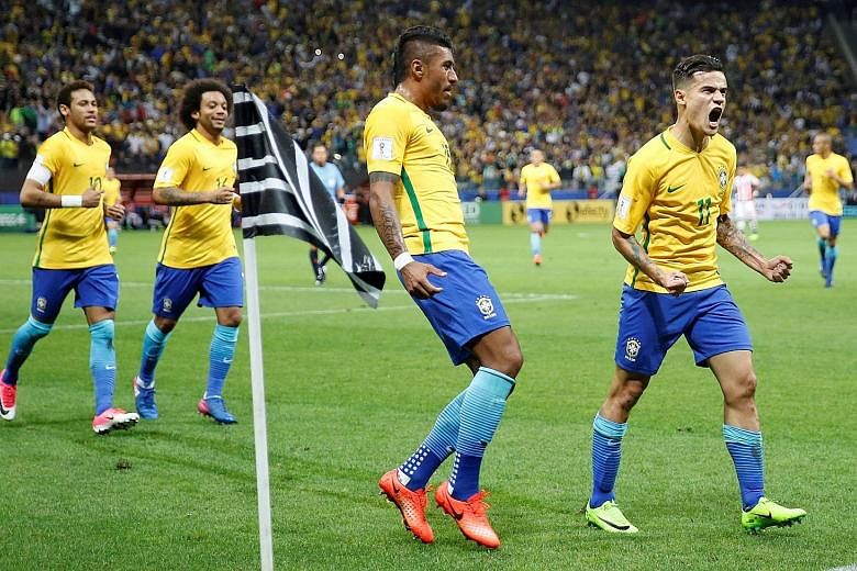 Brazil midfielder Philippe Coutinho (right) celebrates his goal with his team-mates. He put his side 1-0 up on 34 minutes.
