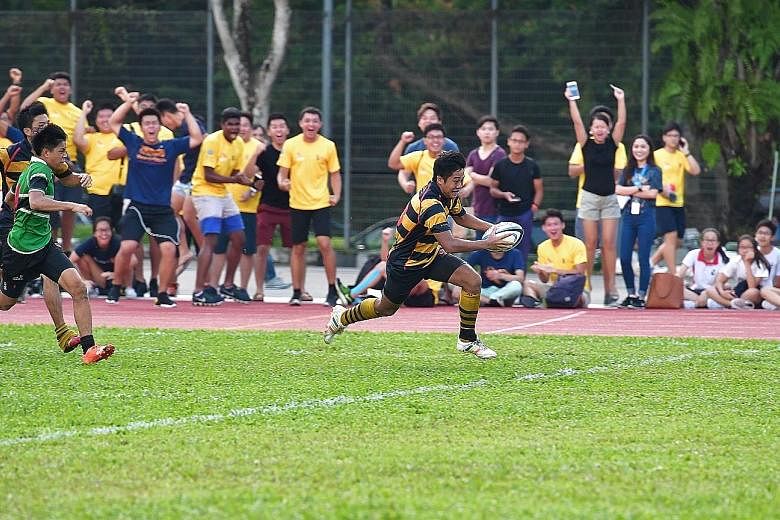 Finan Siow of Anglo-Chinese School (Independent) scoring his side's second try in the 25-12 victory in the Schools National B Division rugby final against Raffles Institution yesterday. ACS(I) have now won the title three times in a row.