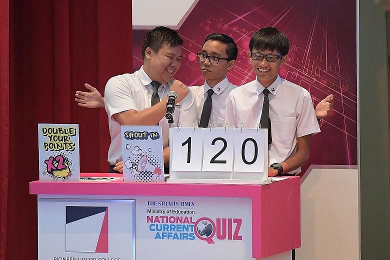 Pioneer JC team members (from left) Clifford Foo, Syakir Mohaium and Ethan Lim, 18, at the first round of this year's The Big Quiz yesterday. They beat two teams from Jurong JC and one from Millennia Institute to emerge as champions.