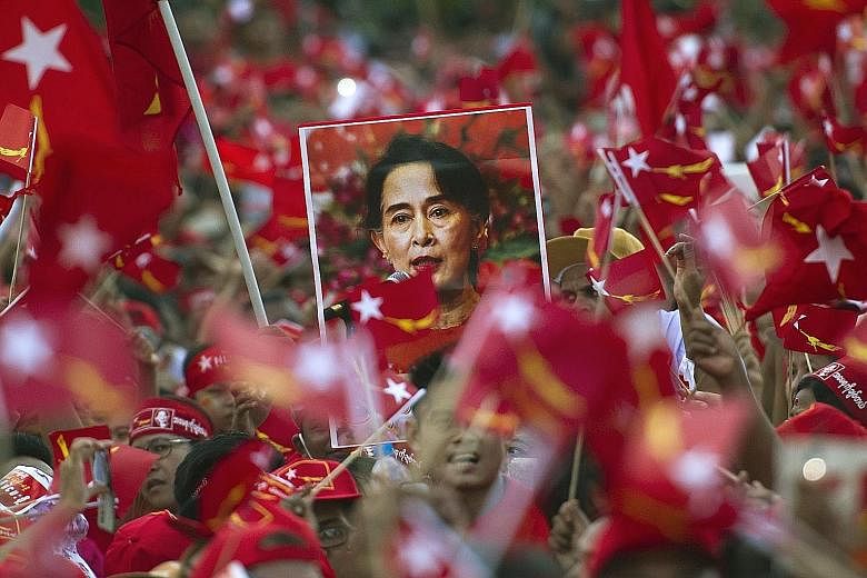 Ms Suu Kyi's supporters at one of her rallies in Yangon in November 2015. Tomorrow's by-election will be her party's first test at the polls since it won a landslide victory in Myanmar's general election that year.