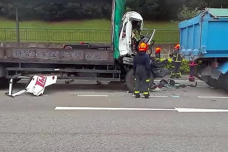 The Singapore Civil Defence Force had to use hydraulic rescue tools to extricate the driver from the lorry after its cab was smashed in.