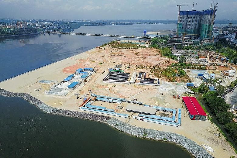 Right: Reclamation work in Johor Baru in support of the Iskandar project, which has drawn Chinese developers. Their mega projects include R&F Properties' Princess Cove. Above: Country Garden's Forest City, whose show-flat drew Chinese visitors on Wed