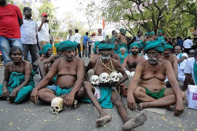 Farmers from Tamil Nadu state, with skulls ostensibly of other desperate farmers who committed suicide, protesting in Delhi to demand more aid from the federal government.