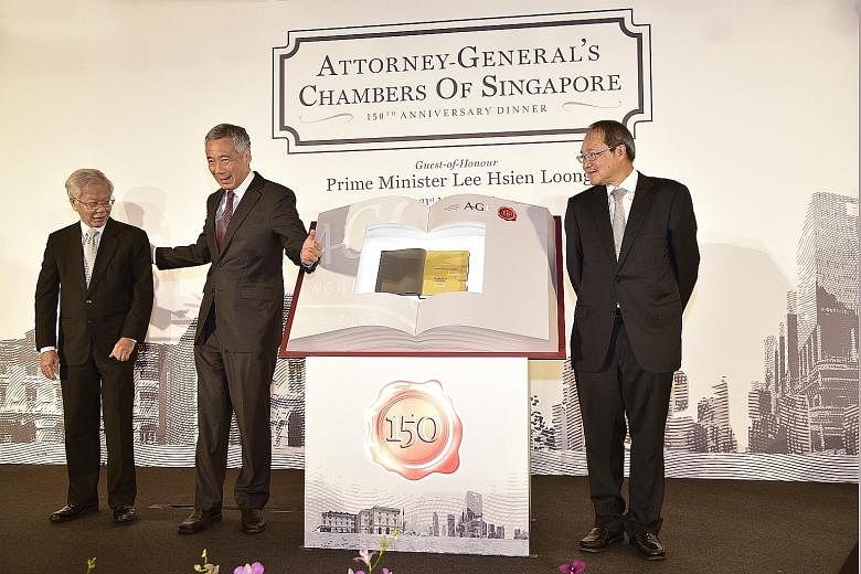Former chief justice Chan Sek Keong (from far left), PM Lee and Attorney-General Wong launching In Chambers: 150 Years Of Upholding The Rule Of Law last night at the anniversary dinner at Gardens by the Bay.