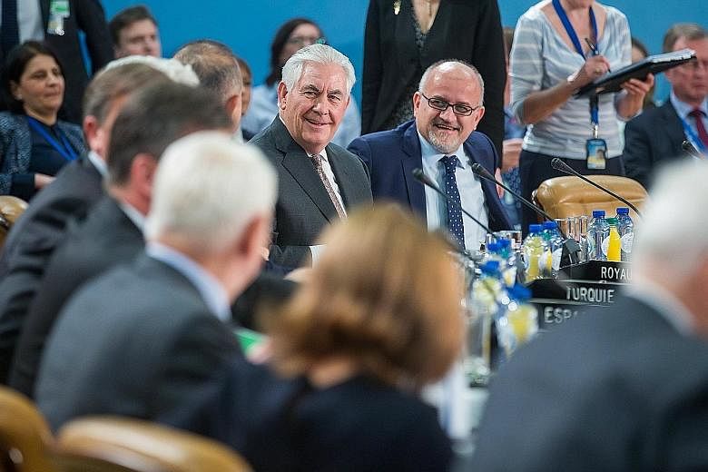 Mr Rex Tillerson (centre) at the Nato foreign ministers' meeting in Brussels yesterday, where he sought to assuage fears that the US administration would seek closer ties with Russia at Nato's expense.