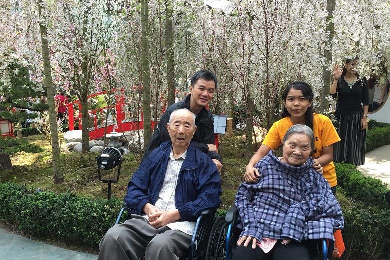 The writer with his parents and their helper, Menti, had a nice break enjoying the cherry blossoms at Gardens by the Bay recently. Mr Goh says that without Menti, it would have been impossible for his parents to continue living in their own home, sur