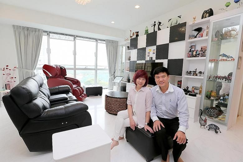 Mr Poh and his wife Linda in their Keppel Bay condo. The bright sunshine streaming in adds to the sense of spaciousness in the living area, which is filled with souvenirs gathered on Mr Poh's travels around the globe.