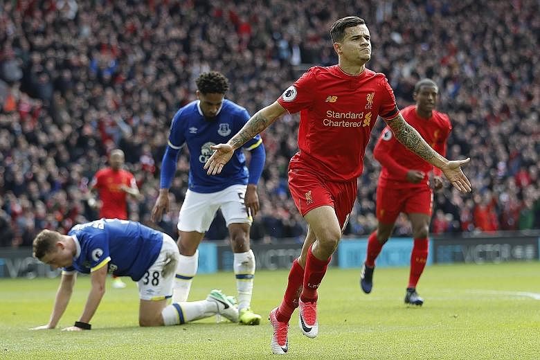 Liverpool playmaker Philippe Coutinho celebrating his 31st-minute goal and his side's second against Everton. Jurgen Klopp's men ran out comfortable 3-1 winners in the Merseyside derby with Coutinho too hot to handle for the Toffees' backline.