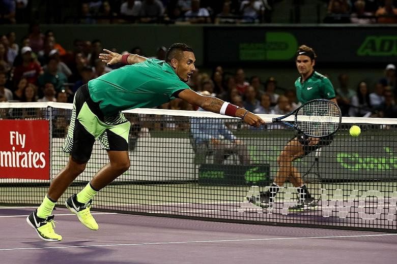 Nick Kyrgios stretching to return a shot from Roger Federer. The Swiss had to draw on all his experience to fend off his tempestuous opponent, and will face old adversary Rafa Nadal in the Miami Open final.