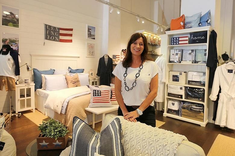 Lexington Store owner Mette Irene Aaboe is hopeful that the new lifestyle quarter Como Dempsey and opening of a fashion store will give the area a boost. Poor retail sales at Dempsey have forced some businesses to slash their prices. Shang Antiques, 