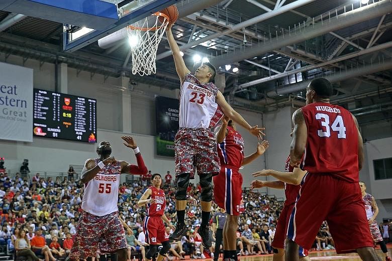 Slingers centre Delvin Goh going up for a basket, as Justin Howard awaits the rebound in Game One of the best-of-three semi-finals against Alab Plipinas. The Slingers won 77-67, with Game Two in Bulacan on Friday night.