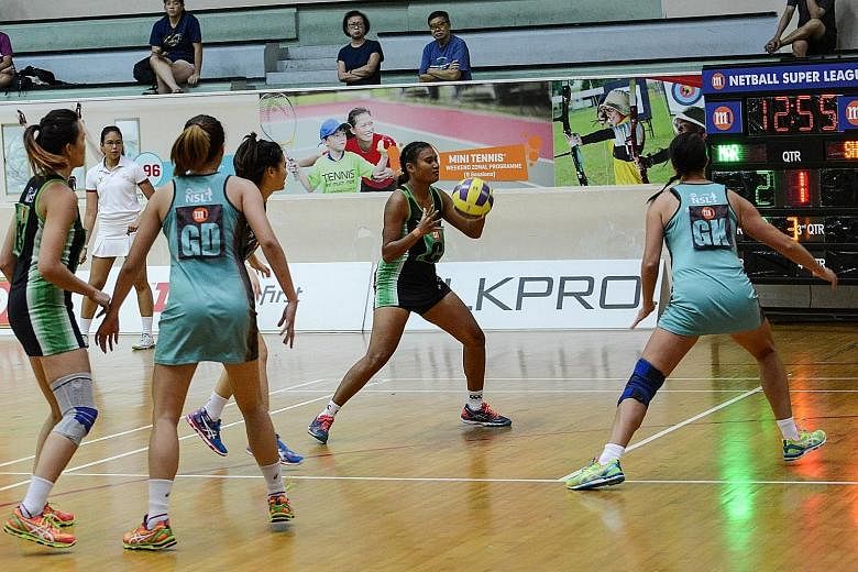 Shanna Dringo (left) of Papua New Guinea was one of two foreign players who played in the Magic Marlins' 66-42 win over the Tiger Sharks during the first day of Round Two Netball Super League matches. Papua New Guinea defender Kilala Owen also featur