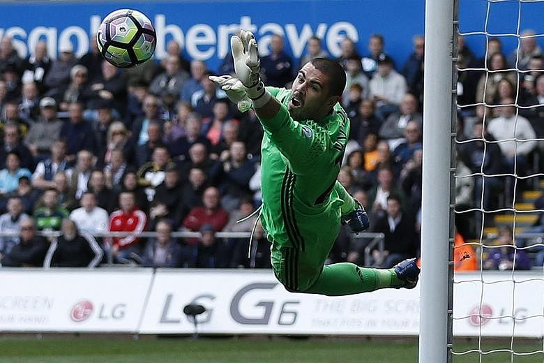 Middlesbrough goalkeeper Victor Valdes diving to make a save. Swansea conjured three shots on target yesterday while fellow Premier League strugglers Boro managed only one.