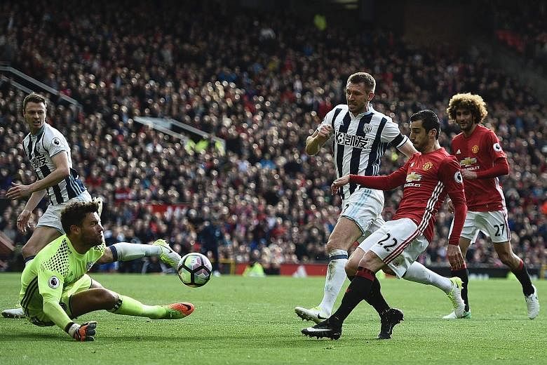 An attempt by United midfielder Henrikh Mkhitaryan being saved by West Brom goalkeeper Ben Foster during their game at Old Trafford. Manager Jose Mourinho has lamented the eight draws and one loss at home that have left them outside the top four spot