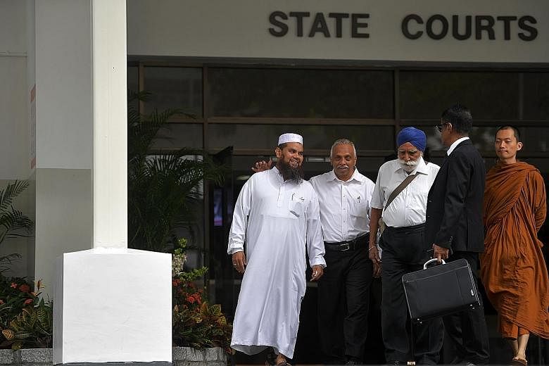 Imam Nalla Mohamed Abdul Jameel leaving court yesterday with religious leaders Haja Maideen of the United Indian Muslim Association, Harbans Singh and Phra Goh Chun Kiang, and lawyer Noor Mohamed Marican. In sentencing, the judge noted the imam's "st