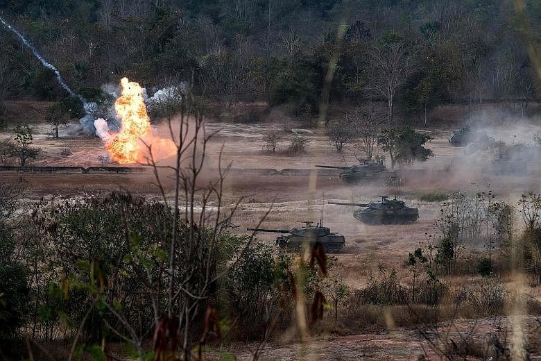 The Thai and US military engaging in a live-fire exercise in north-eastern Thailand on Feb 24. Thailand's Cabinet yesterday approved the $81-million purchase of 10 Chinese tanks to replace US-made rolling stock.