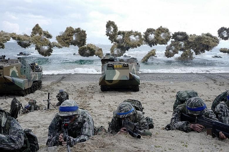 South Korean marines taking part in the annual US-South Korea joint Foal Eagle exercises. Pyongyang has accused the US of holding joint military drills with South Korea and Japan as a dress rehearsal for invasion.