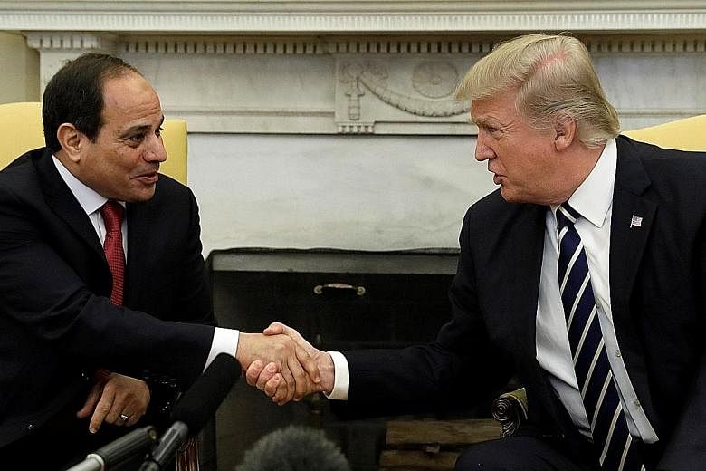 Mr Donald Trump and Mr Abdel Fattah al-Sisi in the Oval Office of the White House in Washington on Monday. A joint statement said the two leaders agreed Islamist militants could not be defeated solely by military force.