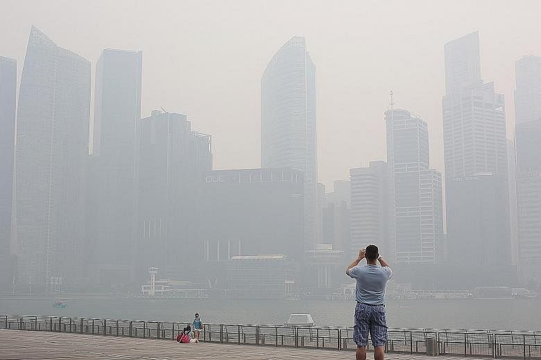 Haze shrouding the Singapore city skyline in June 2013. The results of the study give more urgency to solve the issue of transboundary haze, and the need to protect more vulnerable populations like the elderly at such times.