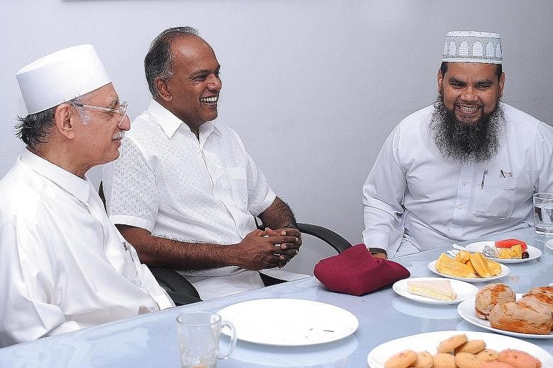 From left: Imam Habib Hassan, Law Minister Shanmugam and Imam Nalla at the Ba'alwie Mosque, where they met for breakfast yesterday together with leaders of the Federation of Indian Muslims and Jamae Chulia Mosque, where Imam Nalla was chief imam. Ima